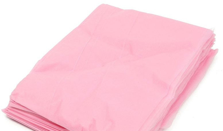 Пеньюар для перукарських робіт 0.9*1.6м Panni Mlada (100 шт. у пакованні) з поліетилену Рожевий