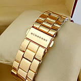 Жіночий кварцевий годинник Burberry А57 на металевому браслеті, золотого кольору, срібний циферблат з датою, фото 3