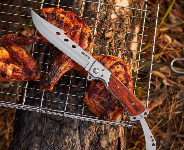 Ніж складний з металевої та дерев'яної ручкою, який продовжує складаний металевий хвостовик