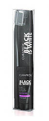 Набір зубна паста Curaprox Black is White, 10 мл і зубна щітка CS 5460 ultra soft (чорного кольору)