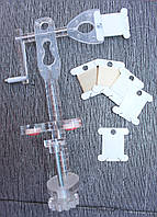 Пристрій для намотування нитки на шпулю