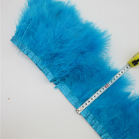 Перова тасьма з пір'я лебедя. Колір Бірюзово блакитний. Перо 10-18 см. Ціна за 0,5 м.