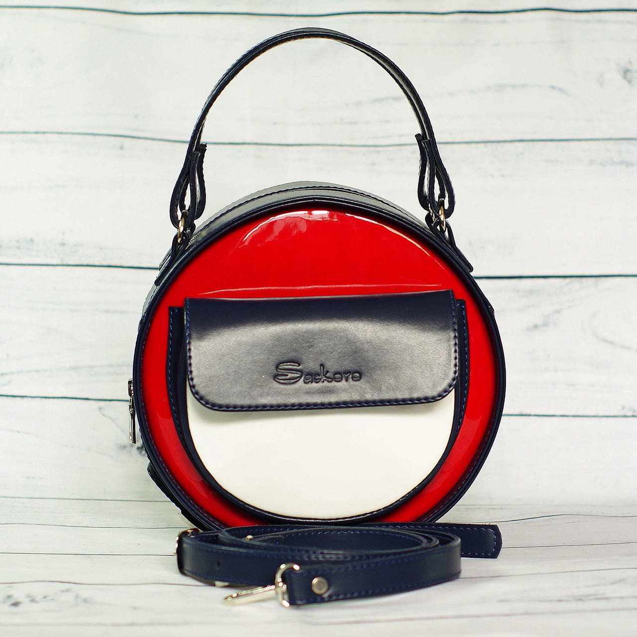 Жіноча, стильна, кругла сумка від виробника, синя з червоними і білими вставками ( код: IBG086ZRO )