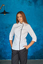 Жіночий кітель білого кольору з чорним кантом