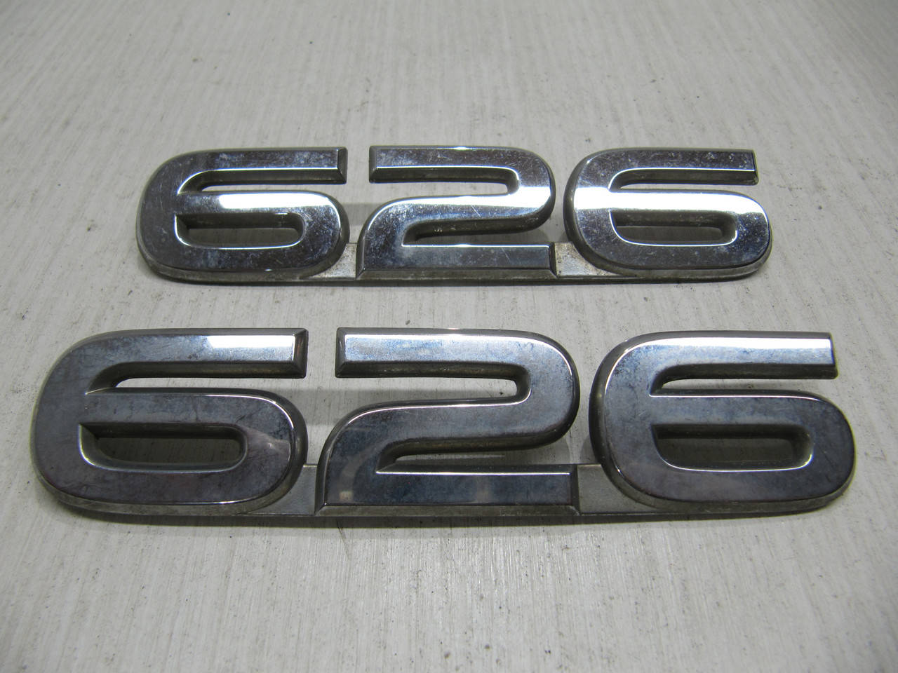 

Эмблема значек шилдик Мазда 626 Mazda 626 GD GE GF Оригинал