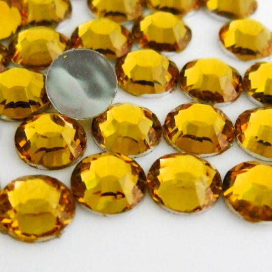 

Стразы эконом Topaz ss20(5мм).Цена за 100шт.