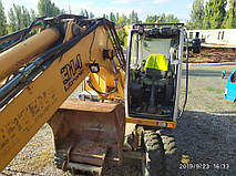 Производство и замена лобового стекла триплекс на экскаваторе Liebherr 314  в Никополе (Украина). 3