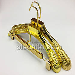 Набір пластикових плічок для одягу золотого кольору, у пакованні 3 шт.