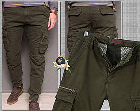 Джинси чоловічі зимові карго з кишенями зелені хакі на гумці 34-й розмір