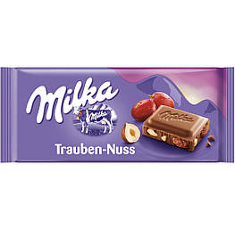 Milka Trauben-Nuss Молочний шоколад із родзинками та дробленим фундуком 100g