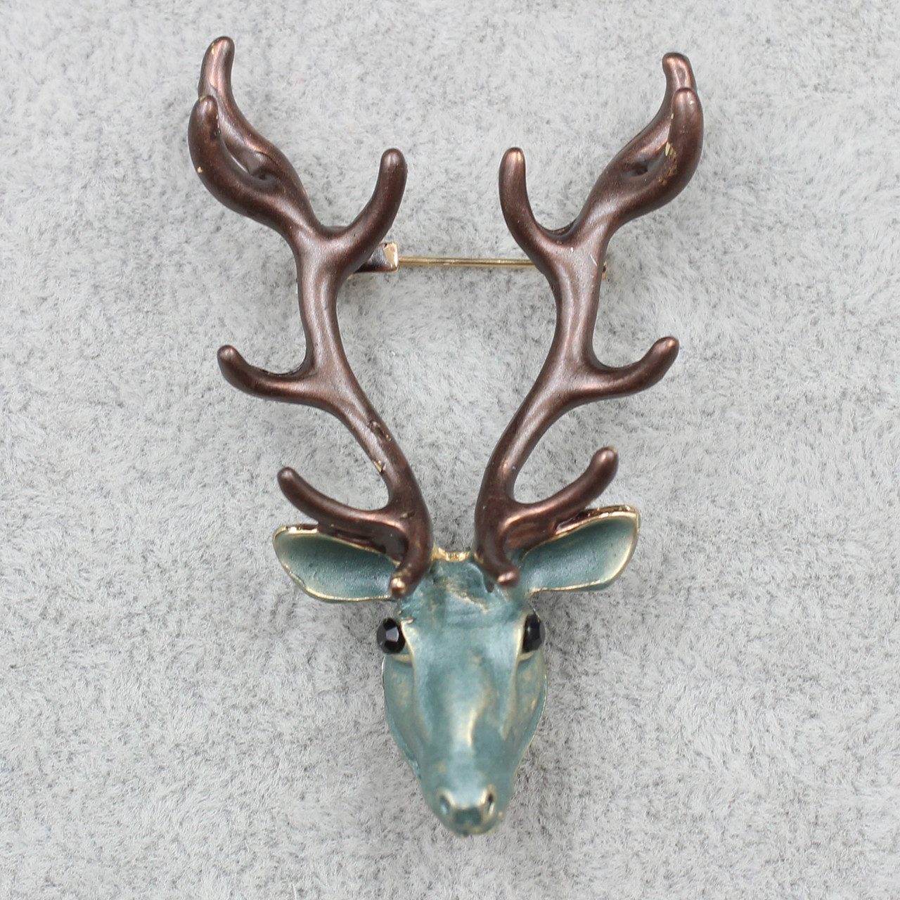 Брошка металева золотиста покрита олень коричневий із чорними рогами розмір виробу 60х35 мм
