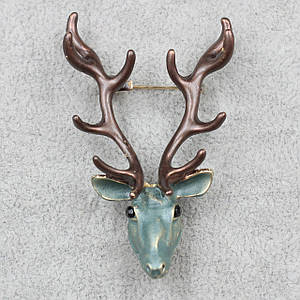 Брошка металева золотиста покрита олень коричневий із чорними рогами розмір виробу 60х35 мм
