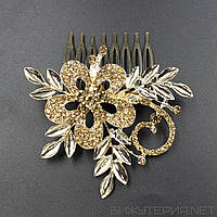 Гребінець на 8 зубців золотистий металевий для волосся з жовтим смарагдовим камінням квіточок із пелюстками