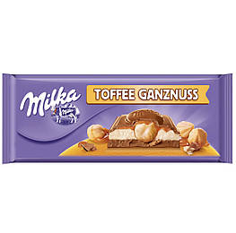 Milka Toffee Ganznuss Молочний шоколад із карамеллю та цілісним фундуком