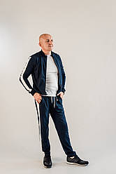 Темний чоловічий спортивний костюм з лампасами синього кольору українського виробництва