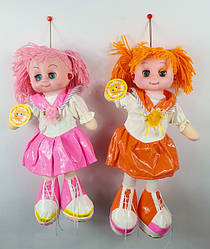 Дитяча лялька в сережках музична в стильному одязі