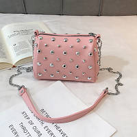 Женская розовая сумка с заклепками