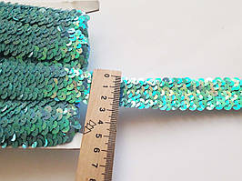 Тасьма гумка еластична з паєтками бірюзово-голуба з перламутровим переливом 2,5-3 см.