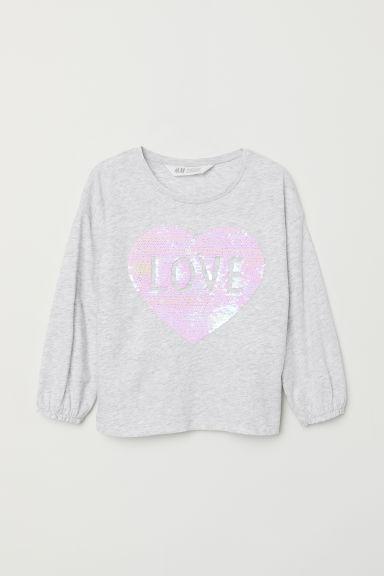 Сірий реглан із реверсивним сердечком із паєток H&M р.122/128 см.