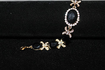 Витончений браслет золотистий з чорними камінням