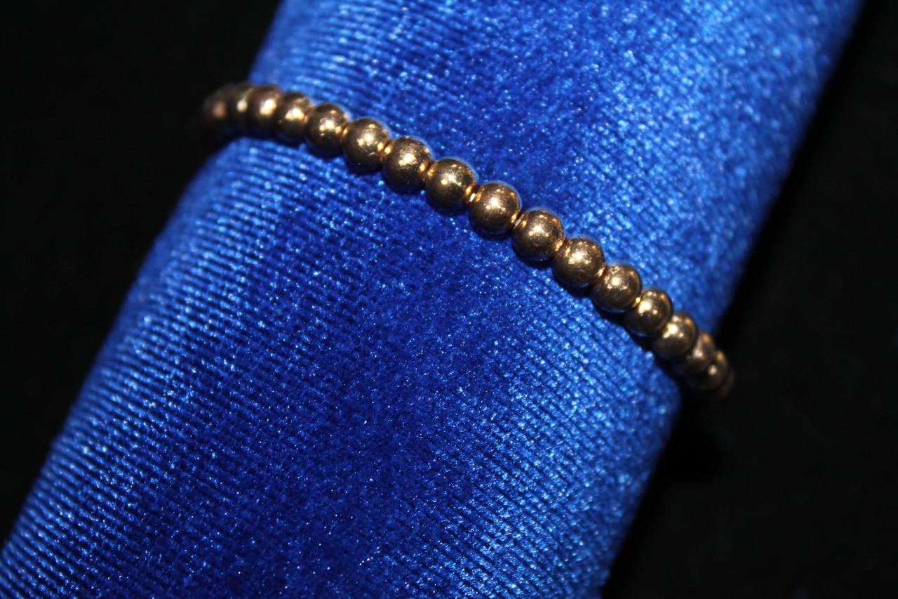 Красивий жіночий браслет на руку на резинці золотистий, фото 1