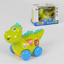 Іграшка Музичний динозаврик Діно 7725 (18/2) їздить, підсвічування, англ. озвучування, в коробці