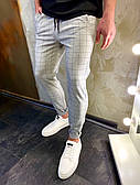 Штани чоловічі світло-сірі картаті штани