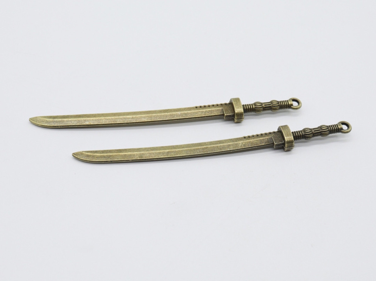 Металеві накладки мечі колір "антична бронза" 105х10 мм Товари для рукоділля та творчості