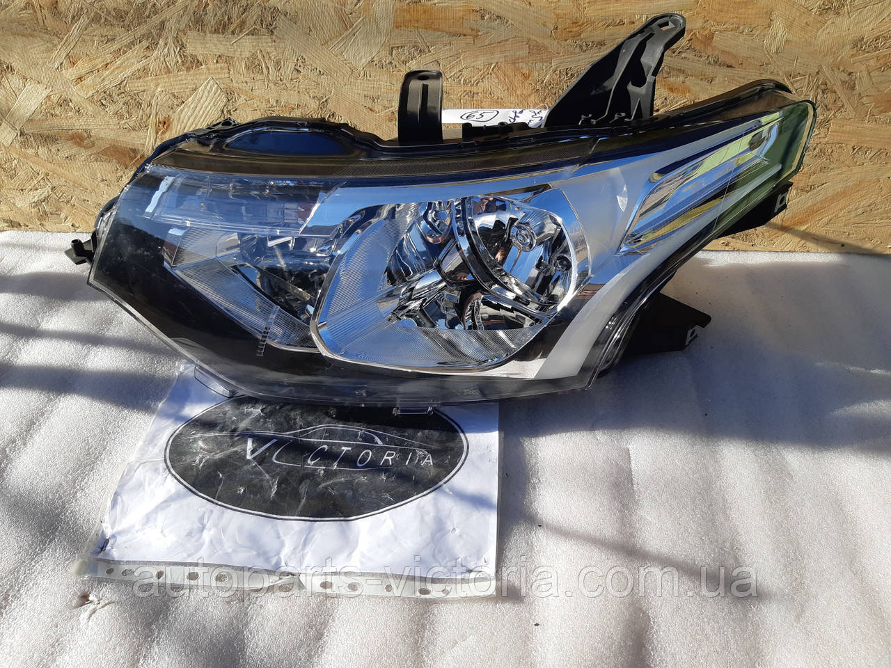 Фара ліва Mitsubishi 8301C203 Outlander 2013-15 Европа вживана