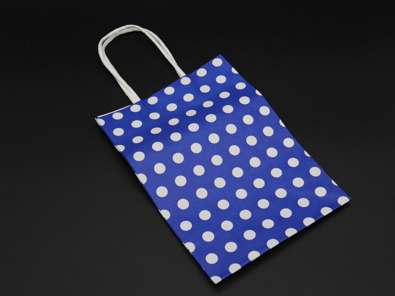 Бумажный крафт-пакет одноразовый в горошек. Цвет синий. 15х8х21см ...