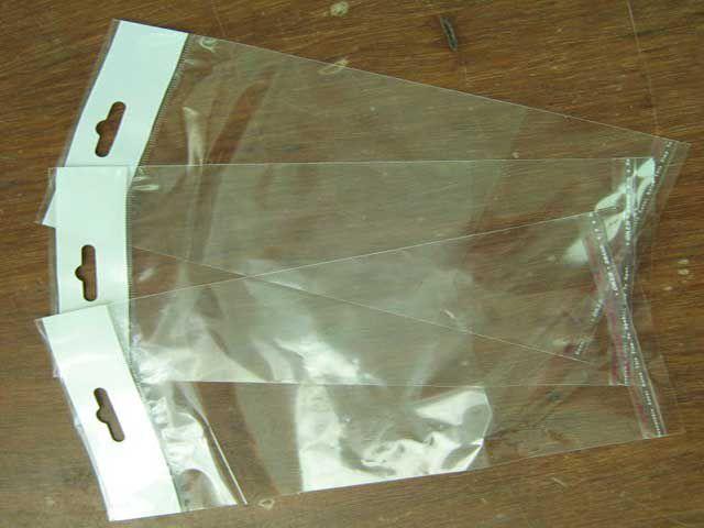 Пакеты для упаковки прозрачные с клейкой лентой и подвесом, 9*22,5см, 1000шт\пач - фото 1 - id-p510511937