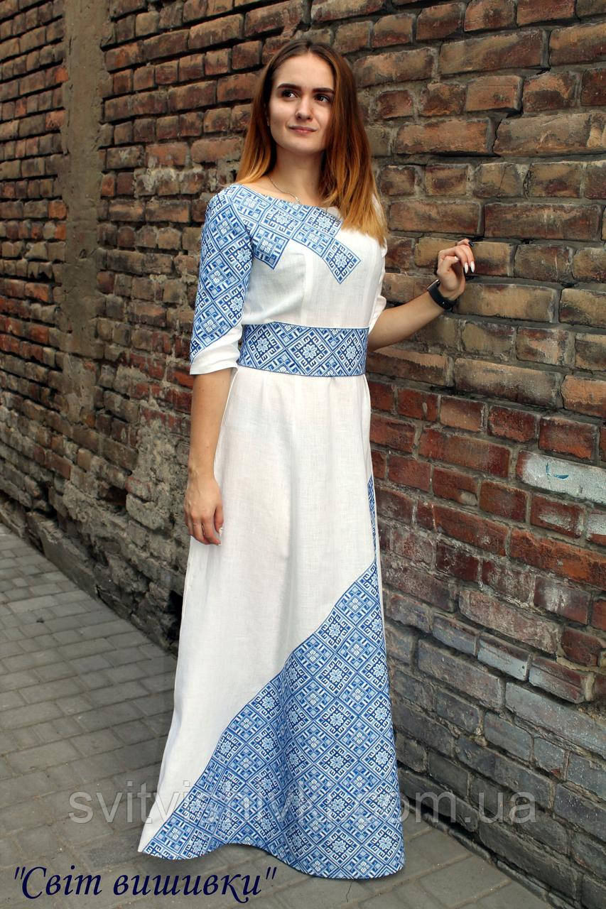 Біла жіноча вишита сукня з блакитною вишивкою "Сварог"