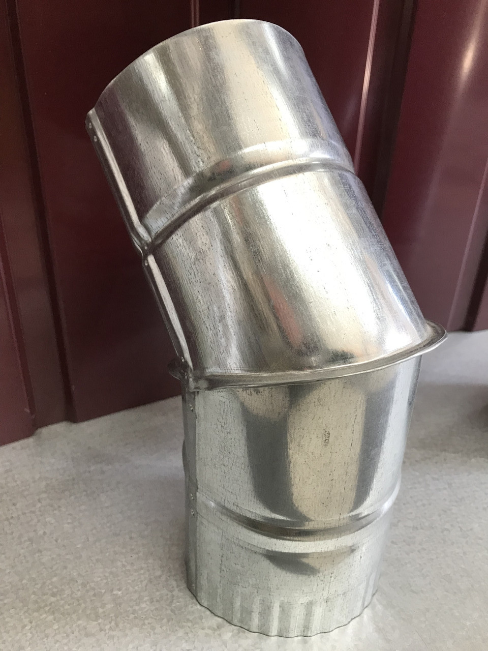 Коліно оцинковане 45 градусів цинк 0'40