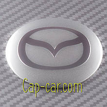 Наклейки 56 мм для дисків з емблемою Mazda. (Мазда) Ціна вказана за комплект із 4 штук