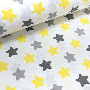 Бавовняна тканина польська зірки (пряники) сіро-жовті на білому