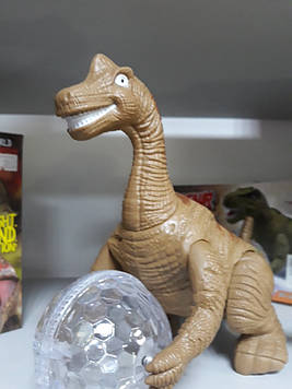 Динозавр музичний світиться з кулею їздить