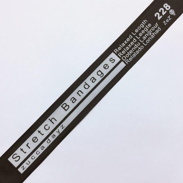 Тесьма репсова 25 мм колір чорний + напис (рул 100ярд=91,44м)