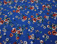 Коттоновая итальянская ткань хлопок с эластаном разноцветные цветы на фоне синего цвета CH 186