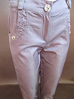 Шкільні штани зі стразами на кишенях.