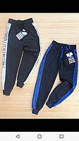 Спортивные штаны для мальчика на 9-12 лет синего, черного цвета с надписью на манжете оптом