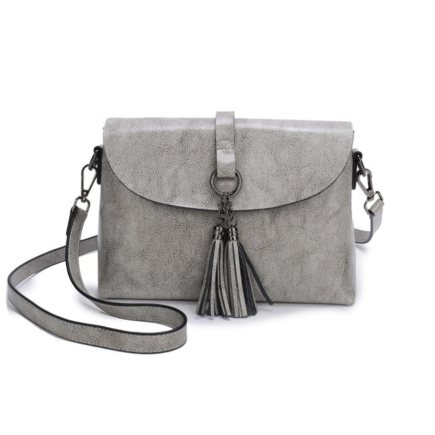 Шкіряна жіноча сумка з натуральної шкіри. Сумка жіноча шкіряна через плече з китицями (сіра), фото 1