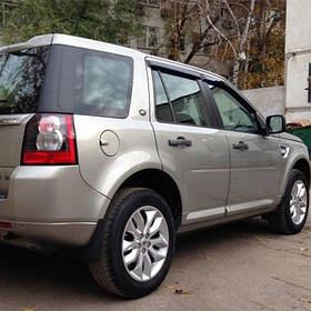 Дефлектори вікон вітровики Ленд Ровер Фрілендер 2 Land Rover Freelander II 06-  КТ (Накладні)