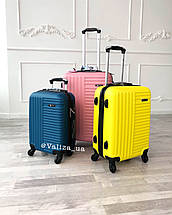 Великий пластиковий чемодан на 4-х колесах якісний жовтий чемодан / Пластикова валіза жовта, фото 3