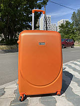 Великий пластиковий чемодан оранжевий з фурнітурою колір / Велика пластикова валіза, фото 3