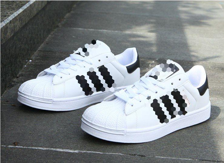 Кросівки білі з чорними смужками 36-й розмір