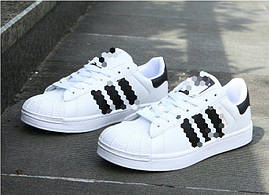 Кросівки білі з чорними смужками 36-й розмір