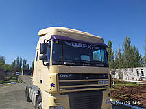 Производство и замена лобового стекла триплекс на грузовике DAF XF 95 с надписью в Никополе (Украина). 5