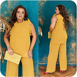 Жіночий гарний літній костюм з жатого льону: блуза і брюки з широкими штанинами, батал великі розміри