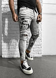 Чоловічі звужені рвані світлі сірі джинси, фото 2