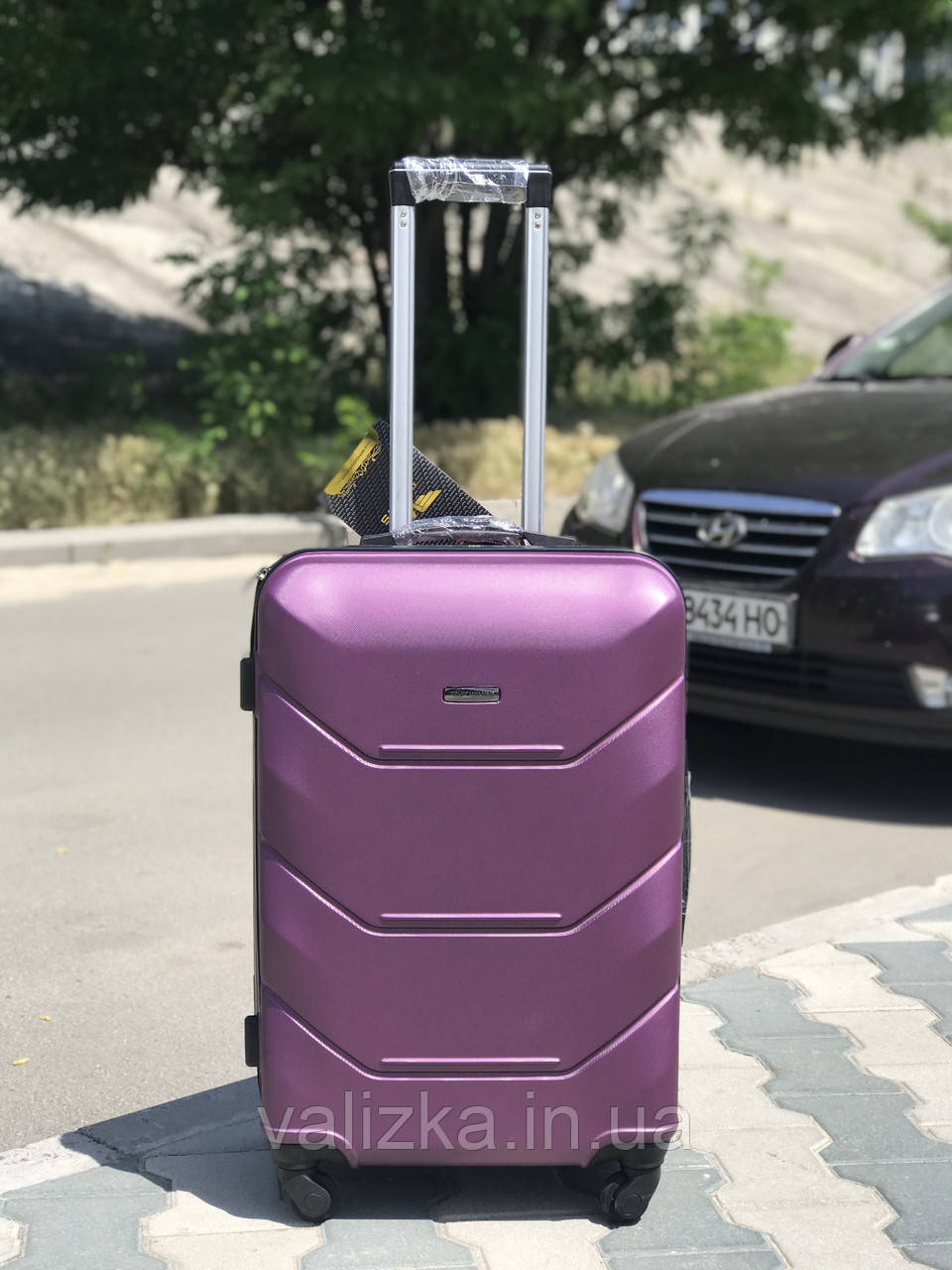 Великий пластиковий чемодан з полікарбонату фіолетовий